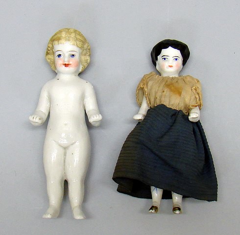 Appraisal: Pair of China Frozen Charlottes Has black hair gold shoes