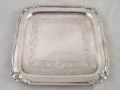 Appraisal: A square silver waiter with shaped corners and stiffened rim