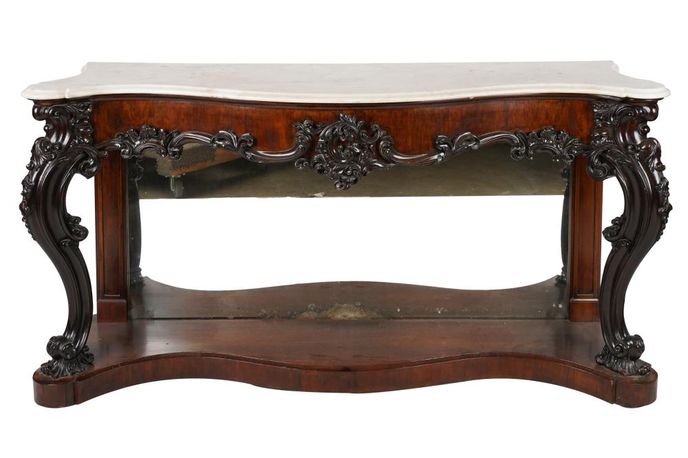 Appraisal: SCOTTISH CARVED MAHOGANY MARBLE-TOP PIER TABLEthe serpentine top joined to