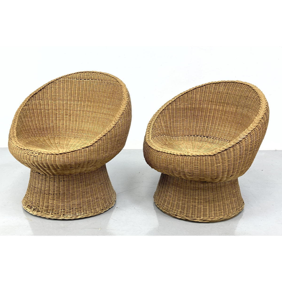 Appraisal: Pr Eero Aarnio style Woven Wicker Saucer Chairs Sliced Sphere