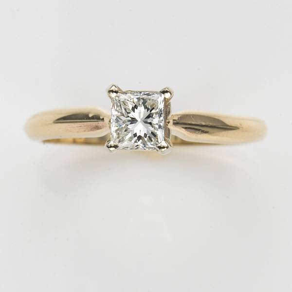 Appraisal: A princess-cut diamond and fourteen karat gold solitaire ring