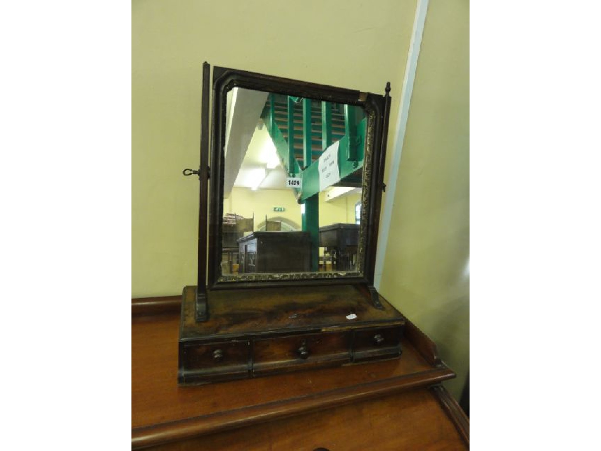 Appraisal: A Georgian mahogany toilet mirror of rectangular form with moulded