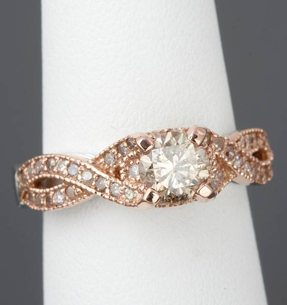 Appraisal: A diamond k white and rose gold ring central diamond