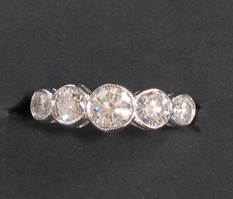 Appraisal: A MODERN DIAMOND HALF ETERNITY RING the five graduated brilliant-cut