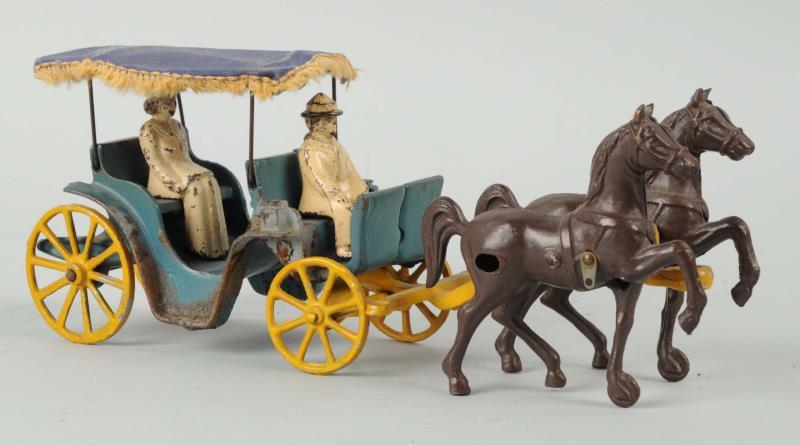 Appraisal: Stanley Toys Cast Iron Horse Buggy With Riders Original canvas