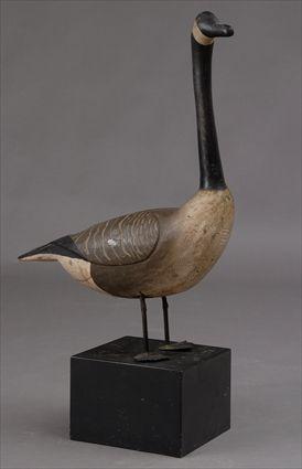 Appraisal: CARVED WOOD MODEL OF A CANADA GOOSE On wrought iron