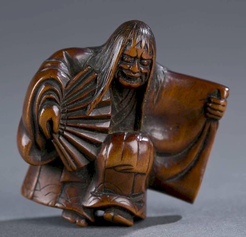 Appraisal: Japanese wood netsuke of a noh dancer A Japanese wood