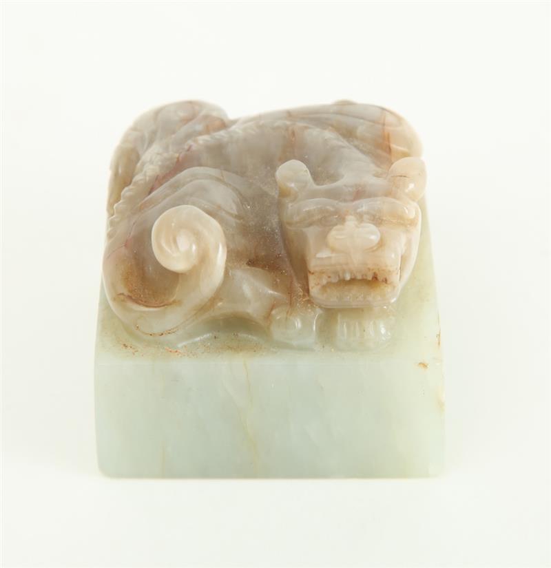 Appraisal: CHINESE CARVED PALE GREEN AND MOTTLED JADE CHOP The base