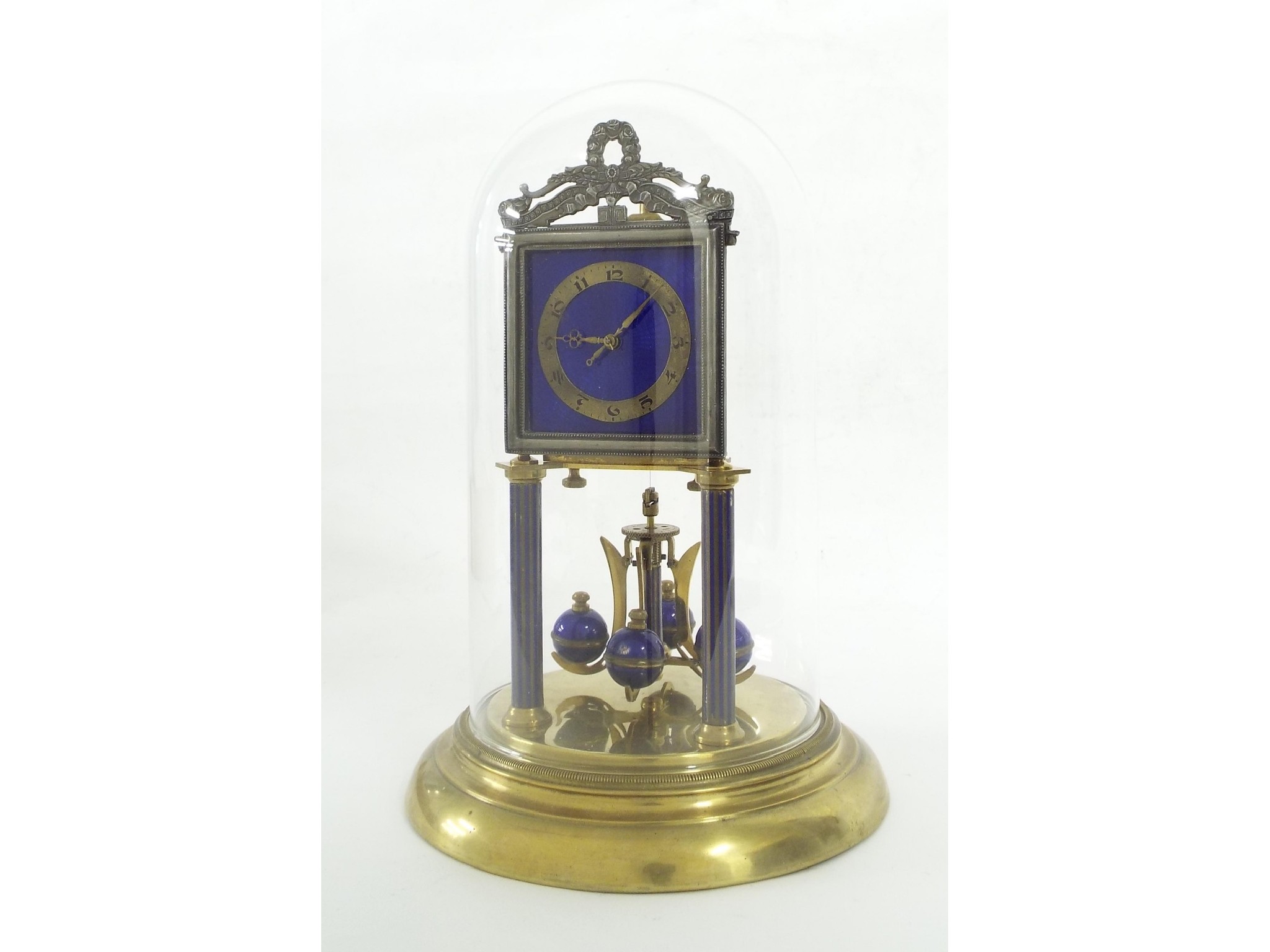 Appraisal: Brass and blue guilloche enamel torsion mantel clock the square