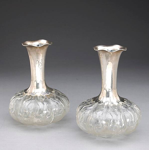 Appraisal: A pair of rock crystal cut glass lobed carafe form