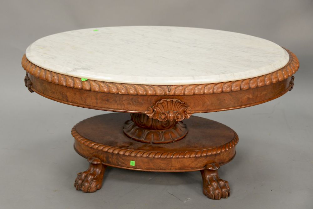 Appraisal: Victorian oval marble top coffee table with large claw feet