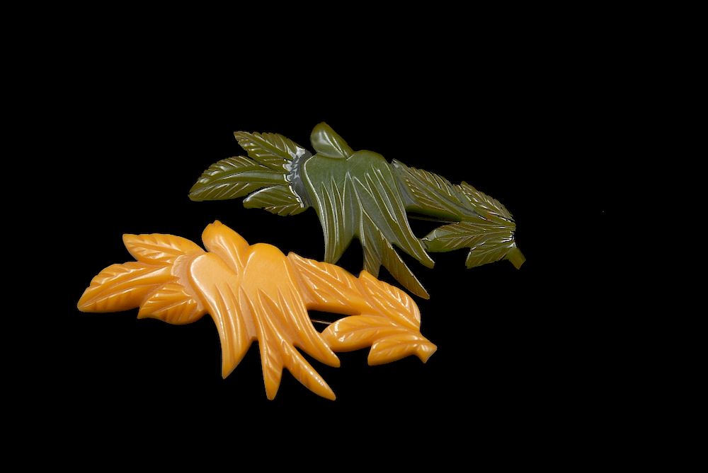 Appraisal: Pair Bakelite Butterscotch And Green Carved Dove Leaf Pair Bakelite