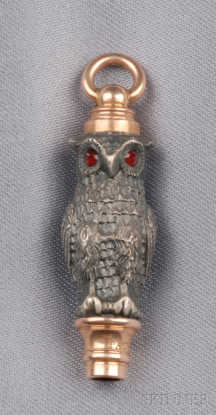 Appraisal: Antique Owl Watch Key the engraved form with garnet eyes