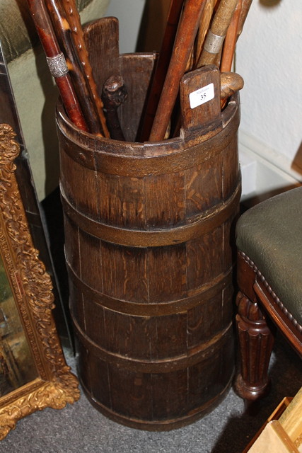 Appraisal: AN OAK STICK STAND of barrel shape form with iron