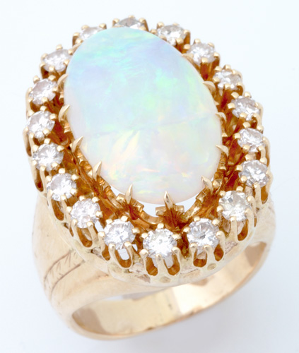 Appraisal: Opal and diamond cluster ring in k yg with an