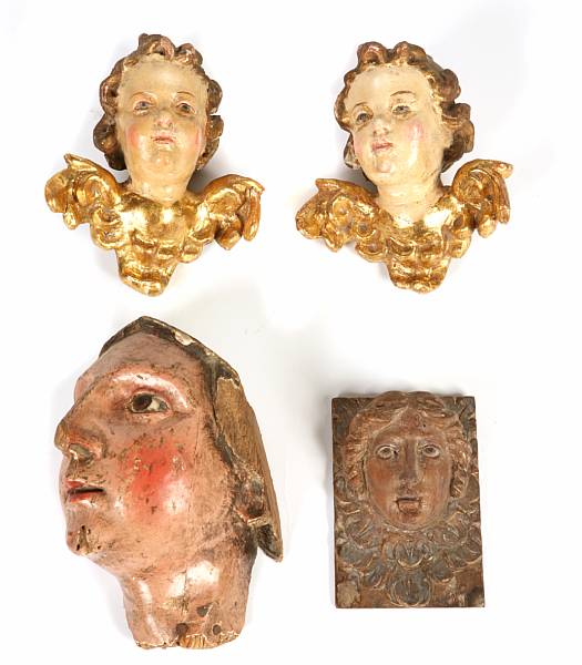 Appraisal: A grouping of four Italian carved and painted wood amorini