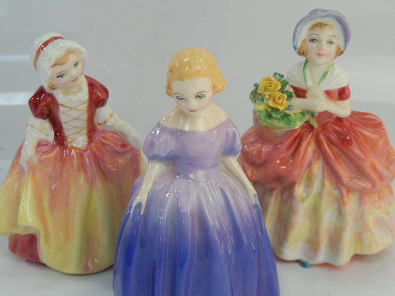 Appraisal: Three Royal Doulton figurines comprising Dinky Do HN Cissie HN