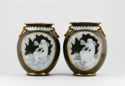 Appraisal: A pair of dark green p te-sur-p te vases probably