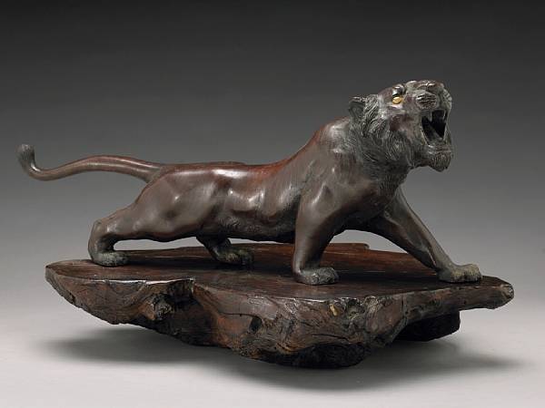 Appraisal: A patinated bronze model of a tiger Taisho Showa Period