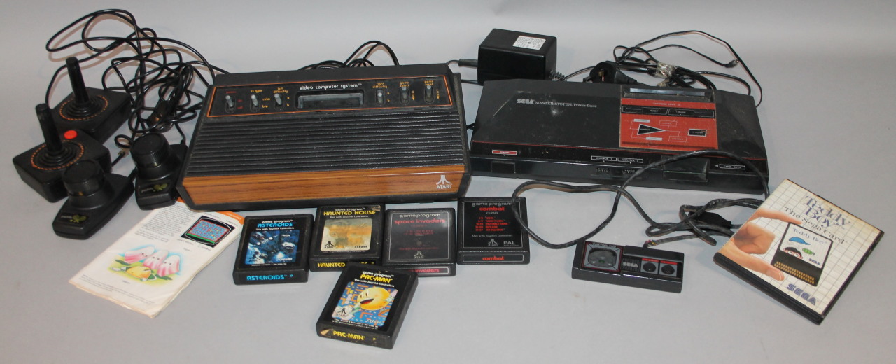 Appraisal: An Atari vintage games console and a quantity of cartridges