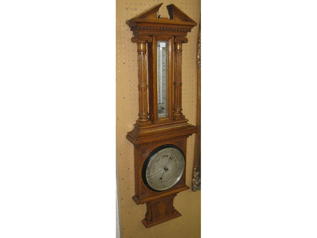 Appraisal: Carved oak framed barometer glass cracked