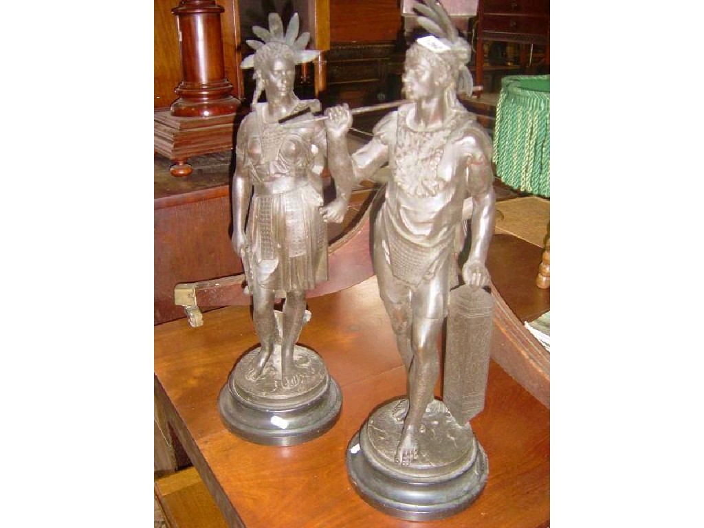 Appraisal: A pair of Spelter figures on circular platform bases male