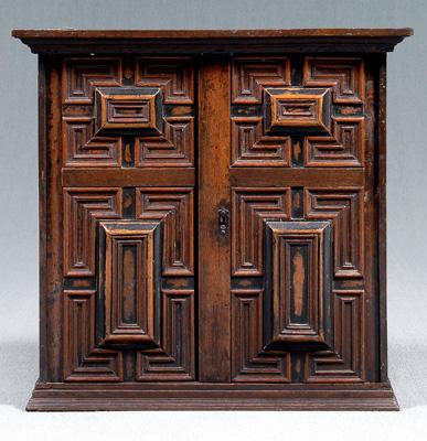 Appraisal: Early oak hanging cupboard applied molded and partially ebonized doors