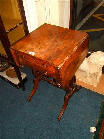 Appraisal: A Regency mahogany drop flap work table fitted two drawers