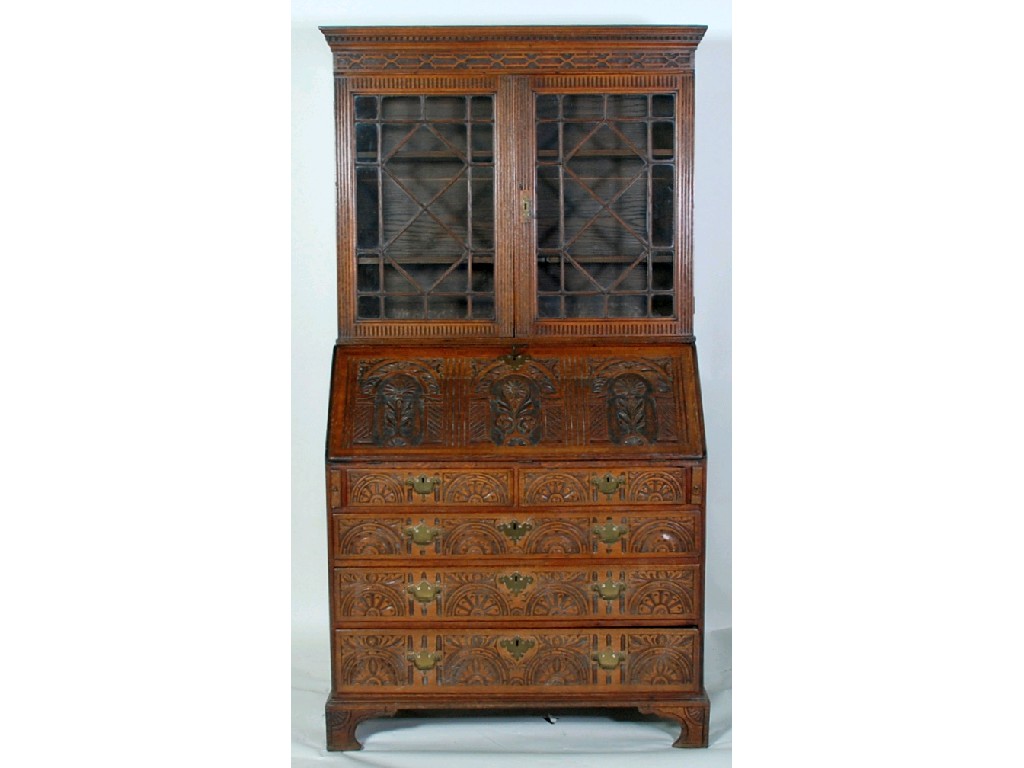 Appraisal: LATER CARVED GEORGIAN OAK AND MAHOGANY CROSSBANDED BUREAU BOOKCASE the