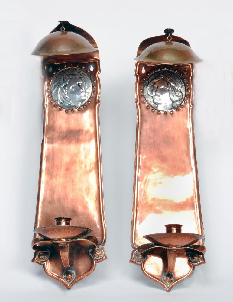 Appraisal: A PAIR OF ARTS AND CRAFTS COPPER WALL SCONCES of