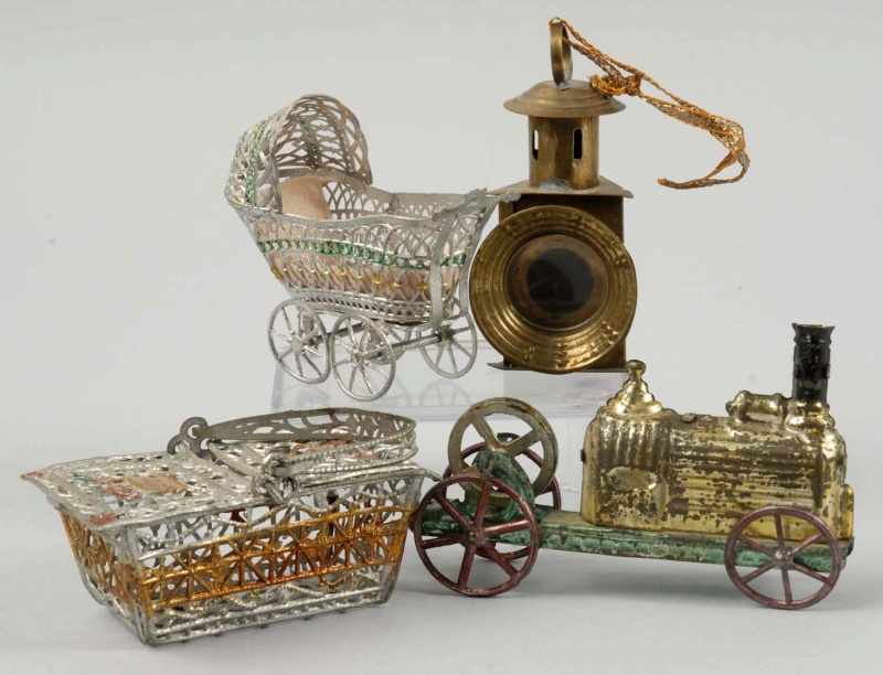 Appraisal: Lot of German Metal Toys Description Includes one doll carriage