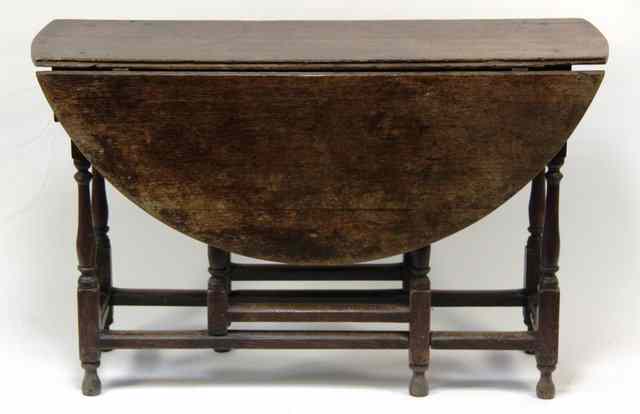 Appraisal: An th Century oak gateleg table the two D shaped