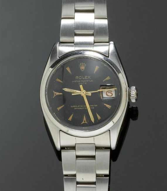 Appraisal: GENTLEMAN'S WRISTWATCH ROLEX DATE s Steel Ref Tonneau-shaped case No