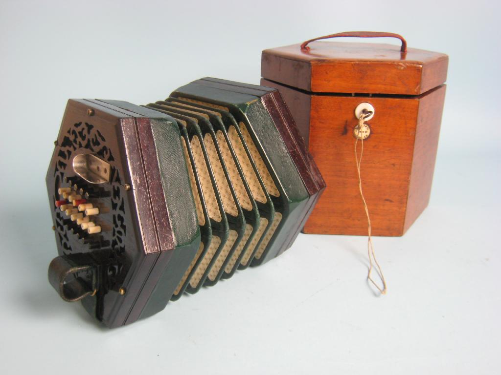 Appraisal: A Lachenal and Co Concertina hexagonal with rosewood ends in