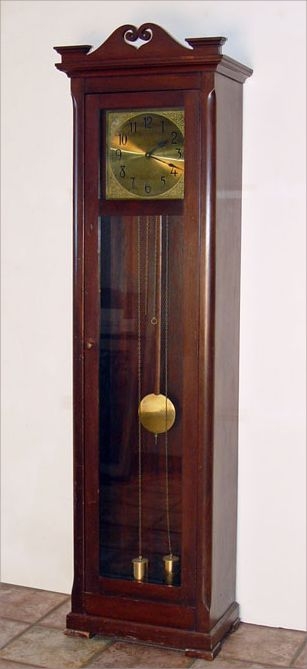 Appraisal: JUNGHANS GERMAN BRASS FACE LONGCASE CLOCK Brass face with cherub