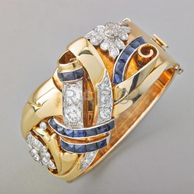 Appraisal: RETRO DIAMOND AND SAPPHIRE HINGED BRACELET Lavish and sculptural k