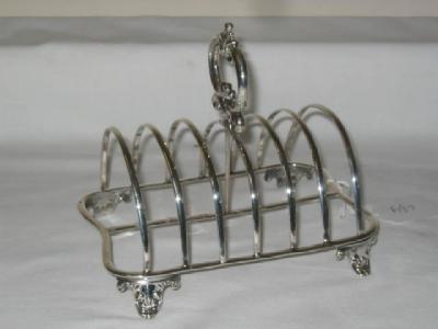 Appraisal: A WILLIAM IV TOAST RACK of waisted oblong form with