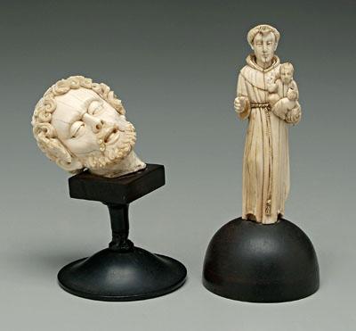 Appraisal: Two carved ivory religious figures Saint Anthony of Padua holding