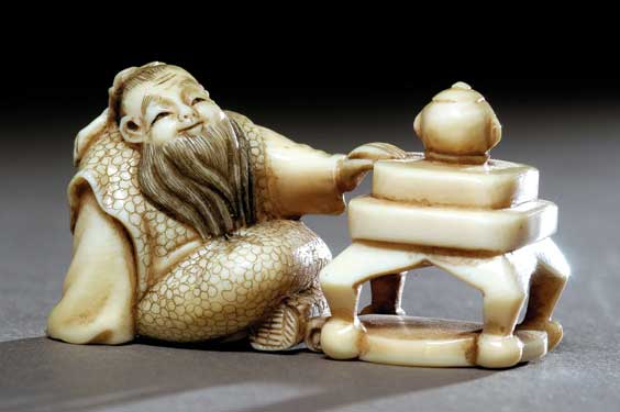 Appraisal: CARVED IVORY NETSUKE Well carved contemporary ivory netsuke of a