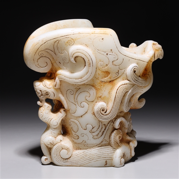 Appraisal: Chinese early style carved hardstone pouring vessel with allover animal