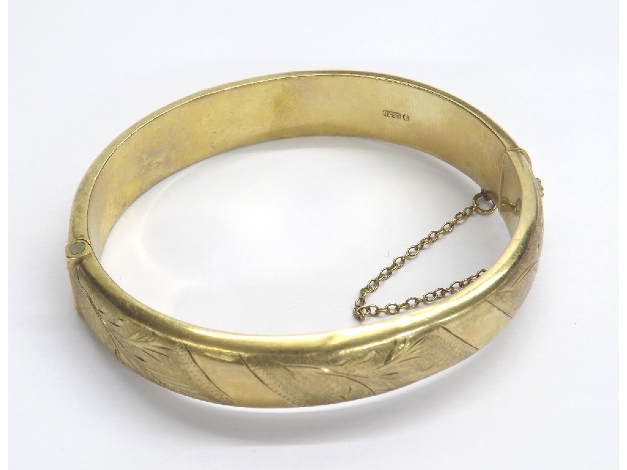 Appraisal: ct yellow gold engraved hinged bangle with safety chain gm