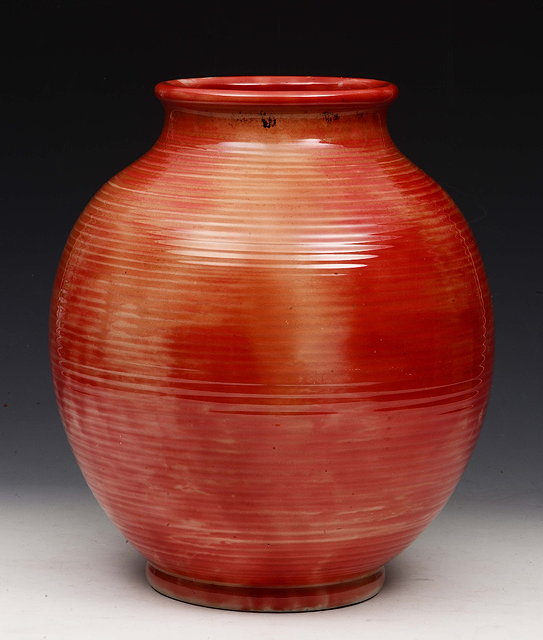 Appraisal: A MOORCROFT BRICK RED GLAZED BALUSTER VASE with ribbed body