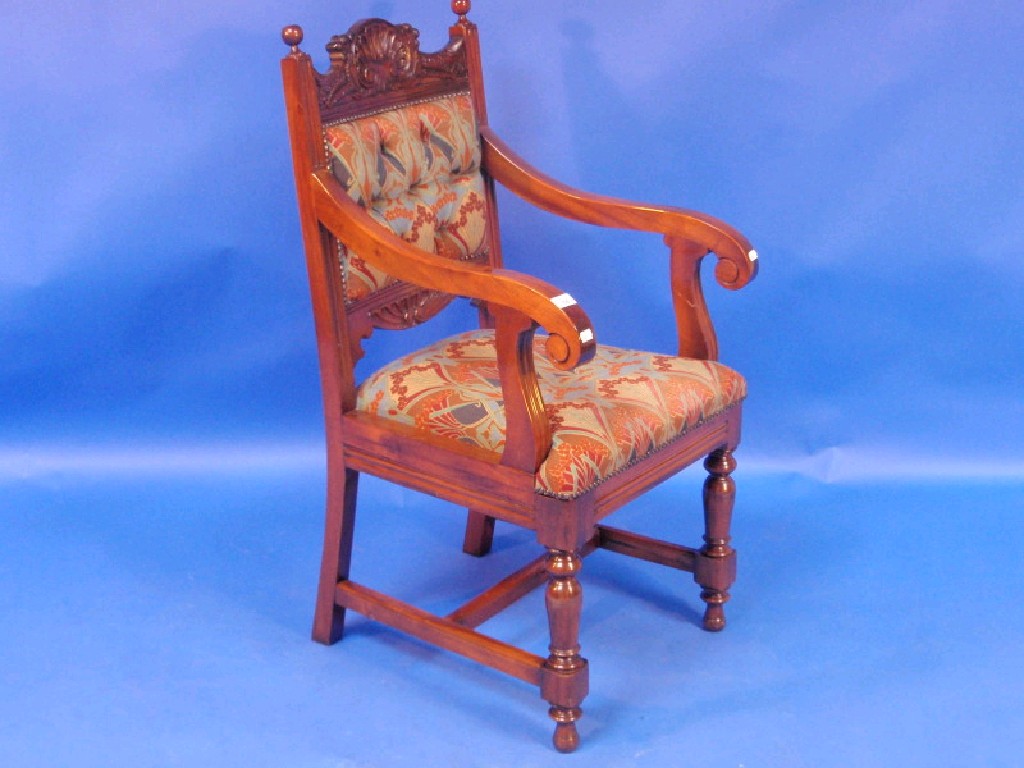 Appraisal: A mahogany open armchair with carved cresting rail and upholstered