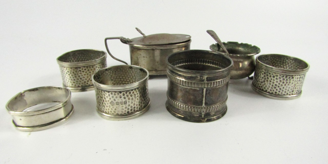 Appraisal: Three George V silver circular napkin rings with beaten decoration