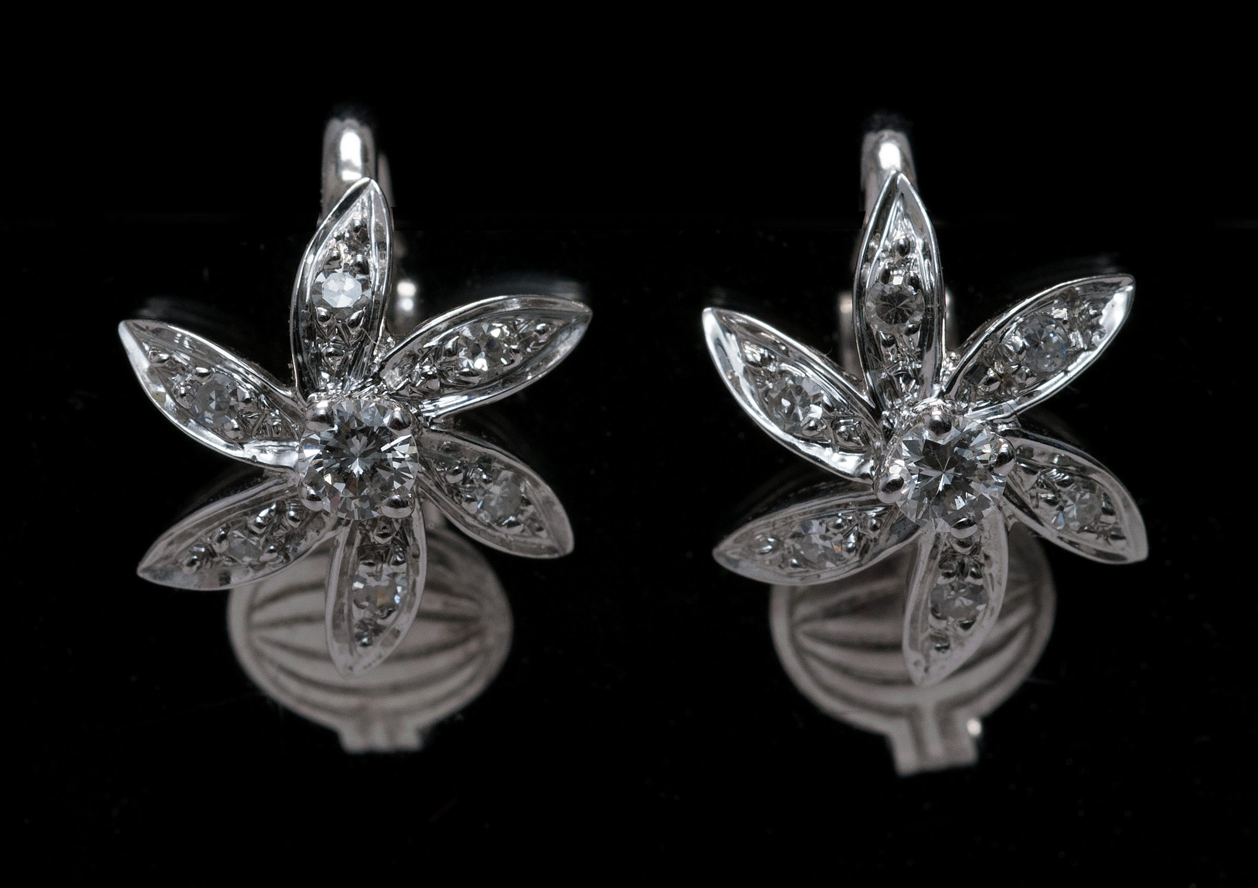 Appraisal: FLORIFORM KT WHITE GOLD AND DIAMOND EARCLIPS Mid- th CenturyEach