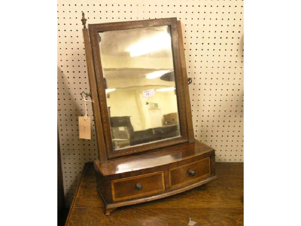 Appraisal: An early th century mahogany veneered toilet mirror bow fronted