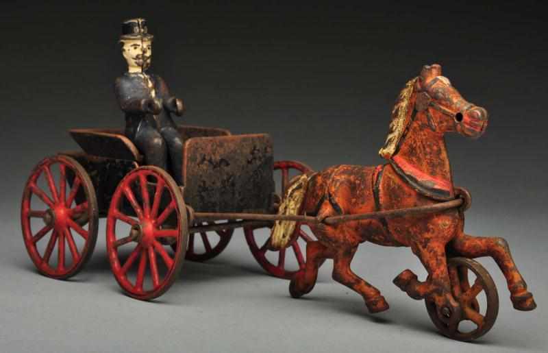 Appraisal: Cast Iron -Wheel Dr 's Cart Horse-Drawn Toy Description Manufactured