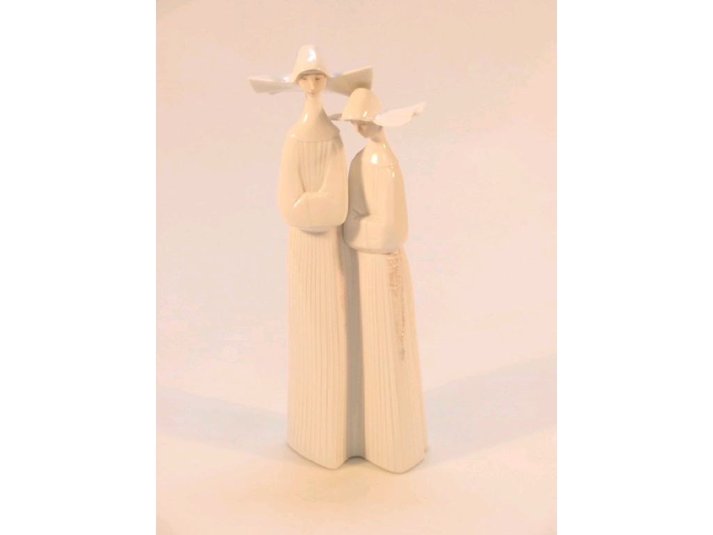 Appraisal: A Lladro figure group of two nuns in white wimples