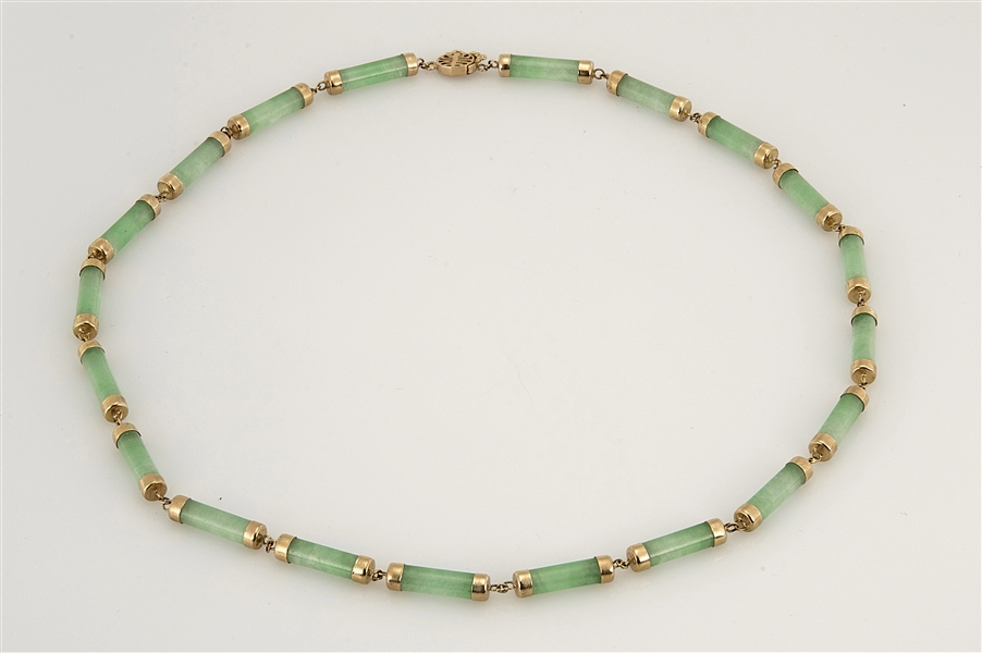 Appraisal: Chinese kt yellow gold and green Jadeite bead choker L