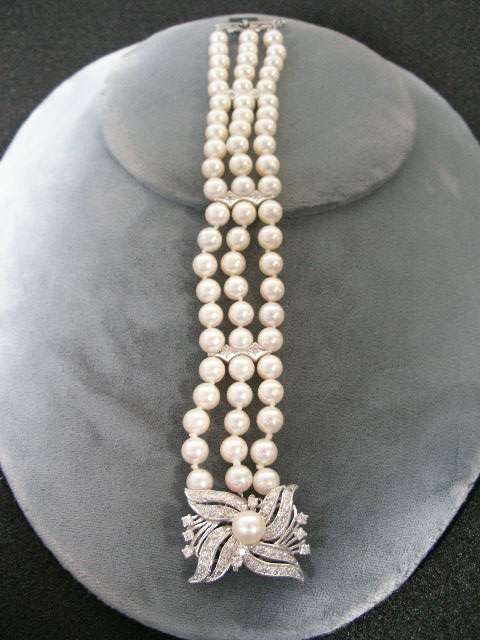 Appraisal: Cultured Pearl Diamond Bracelet triple strand of cultured pearls knotted